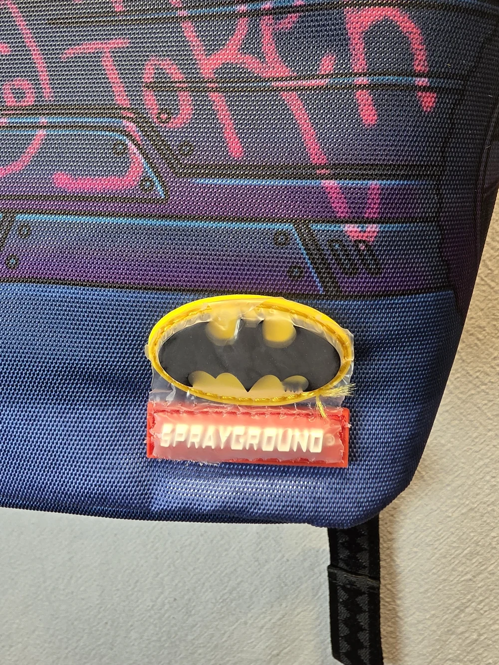Sprayground DC Joker No Rules Backpack featuring a vibrant, graffiti-styled Bag